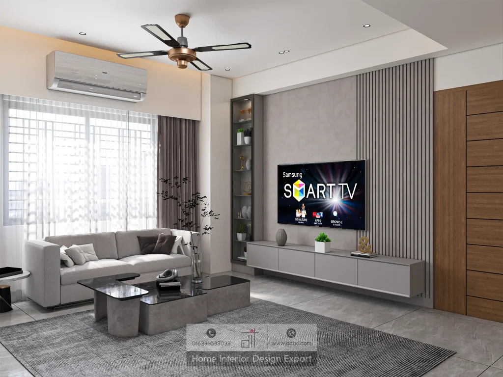 Grey sofa and dark area rug with fluted panel TV wall in Aftabnagar common space by DIT Studio