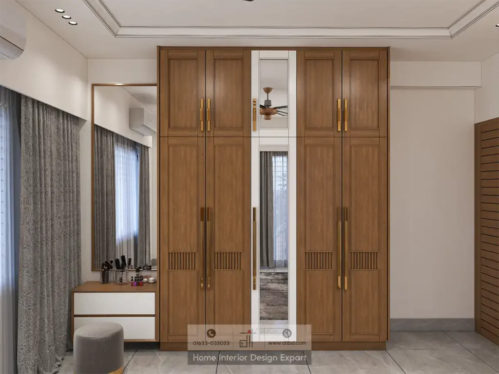 Floor-to-ceiling walnut closet with gold handles and dressing table in Basila designed by DIT Studio