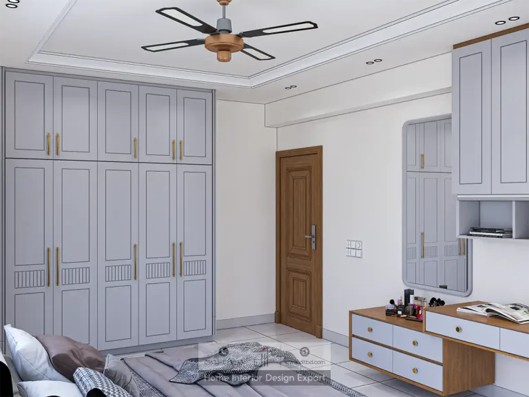 Full-height grey-blue wardrobe with gold handles and dressing table in Aftabnagar by DIT Studio