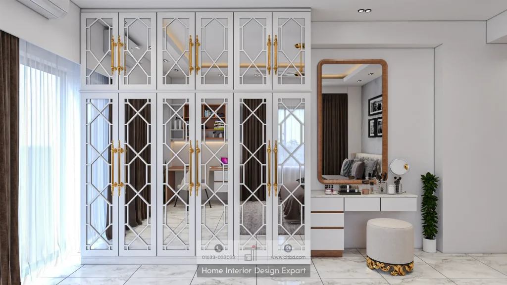 Ornate white mirrored fretwork closet with gold drop handles, walnut-framed vanity mirror, and cream ottoman in Mohammadpur luxury bedroom by DIT Studio