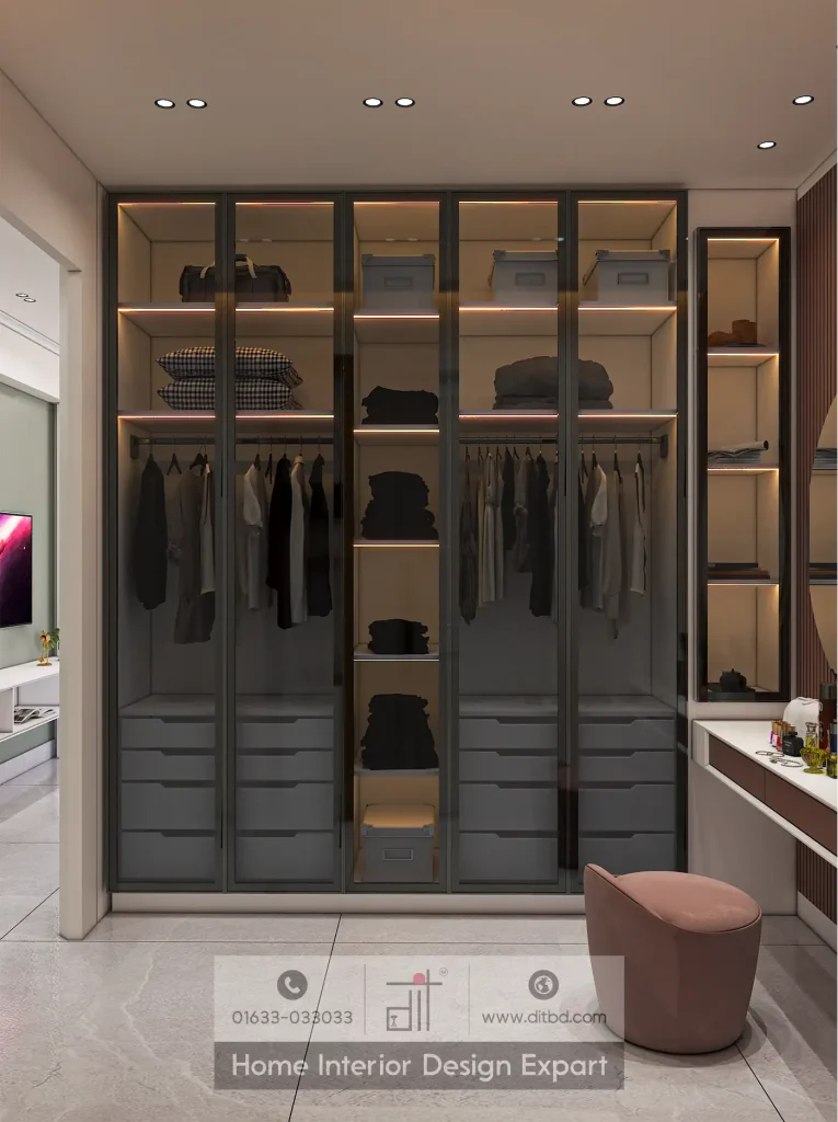 Modern glass-front wardrobe with LED-lit interior and blush velvet stool in luxury closet design by DIT Studio Gulshan-2