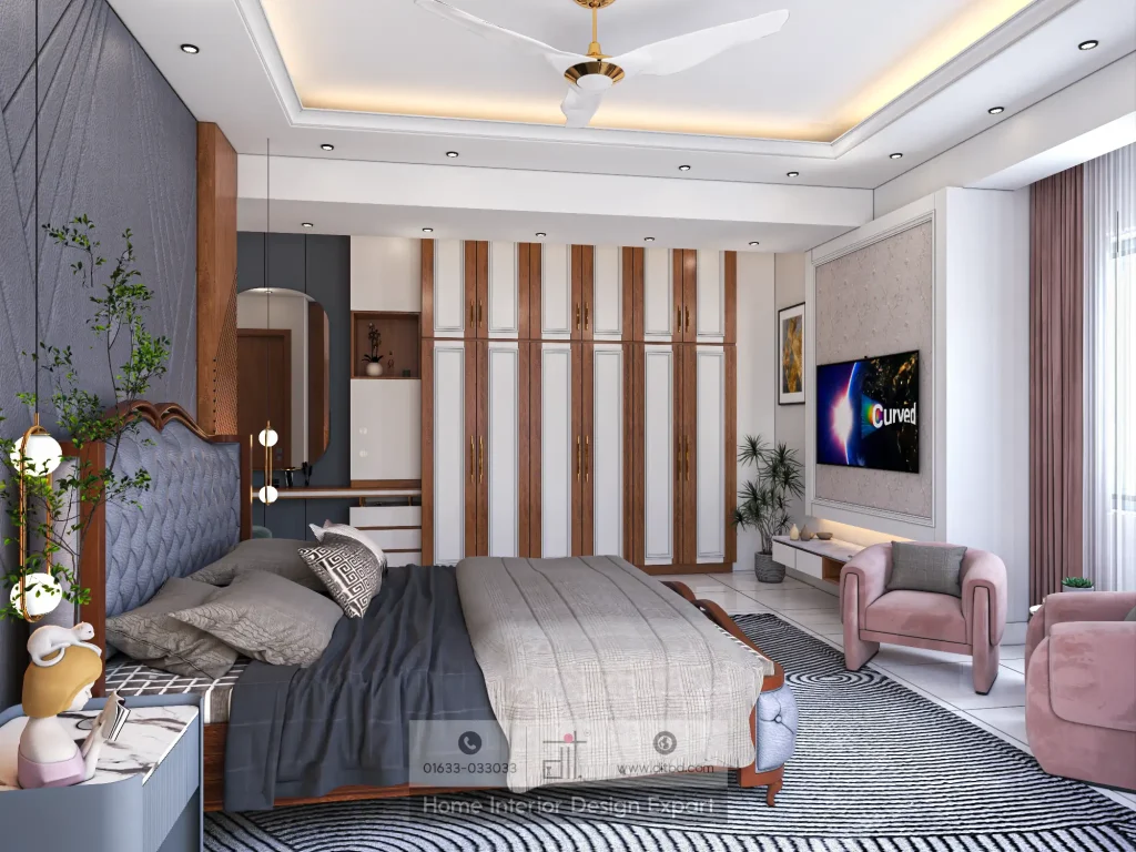 Full bedroom view with navy tufted bed, walnut-white wardrobe, blush pink armchairs, and chevron rug in Mohammadpur apartment