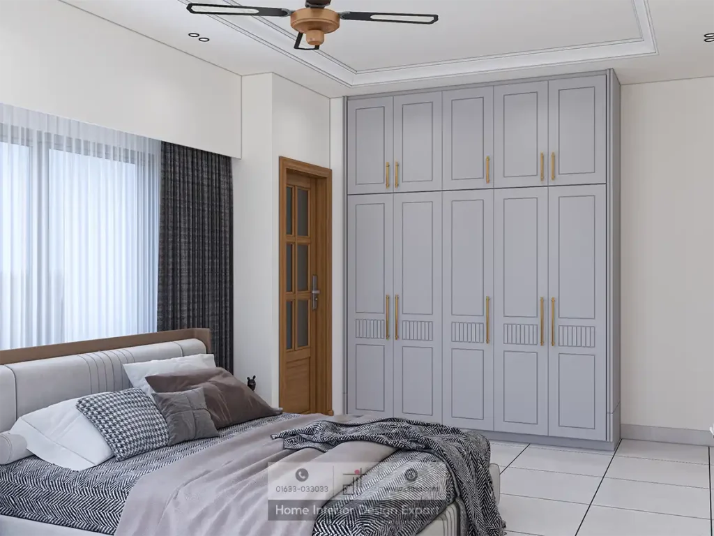 Contemporary bedroom view showcasing a minimalist gray wardrobe, a plush upholstered bed with patterned linens, and dark floor-to-ceiling curtains.