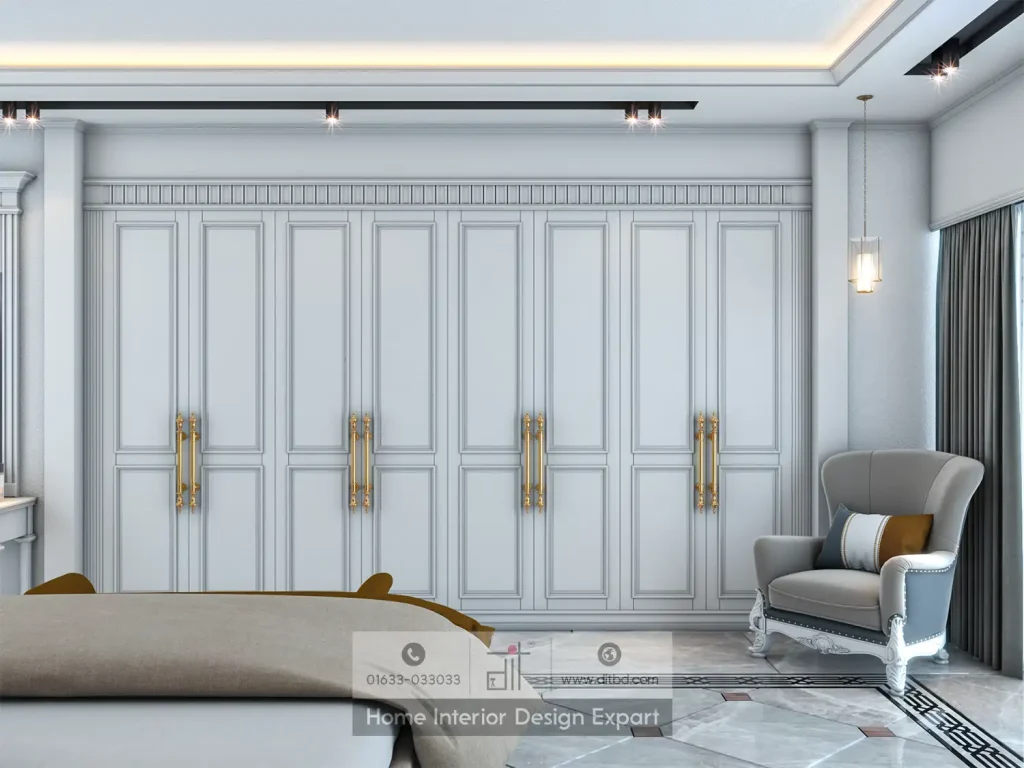 Full-width built-in wardrobe wall with gold bar handles and wingback armchair in Dhanmondi-10A luxury bedroom