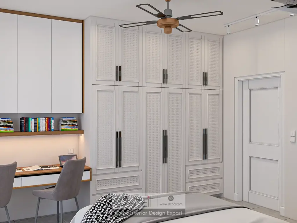 Built-in twin study desk with bookshelf beside cane-weave wardrobe in Mohammadpur by DIT Studio