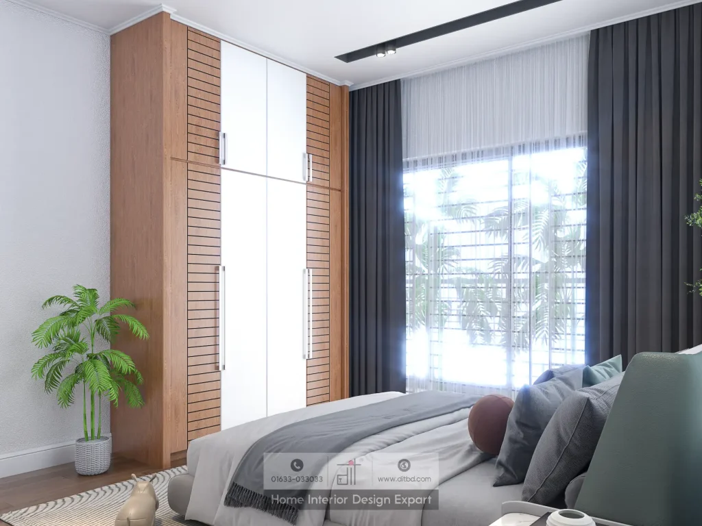 Corner view of minimal guest bedroom showing walnut wardrobe, grey bed with teal pillows, and charcoal curtains in Uttara apartment