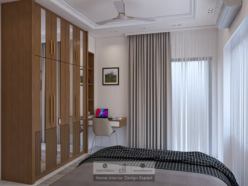 Walnut wardrobe with mirror panels and study desk corner in Basila guest bedroom by DIT Studio