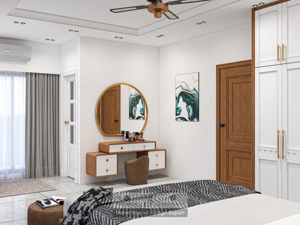 Vanity area with round gold mirror and abstract art in modern Keraniganj bedroom by DIT Studio