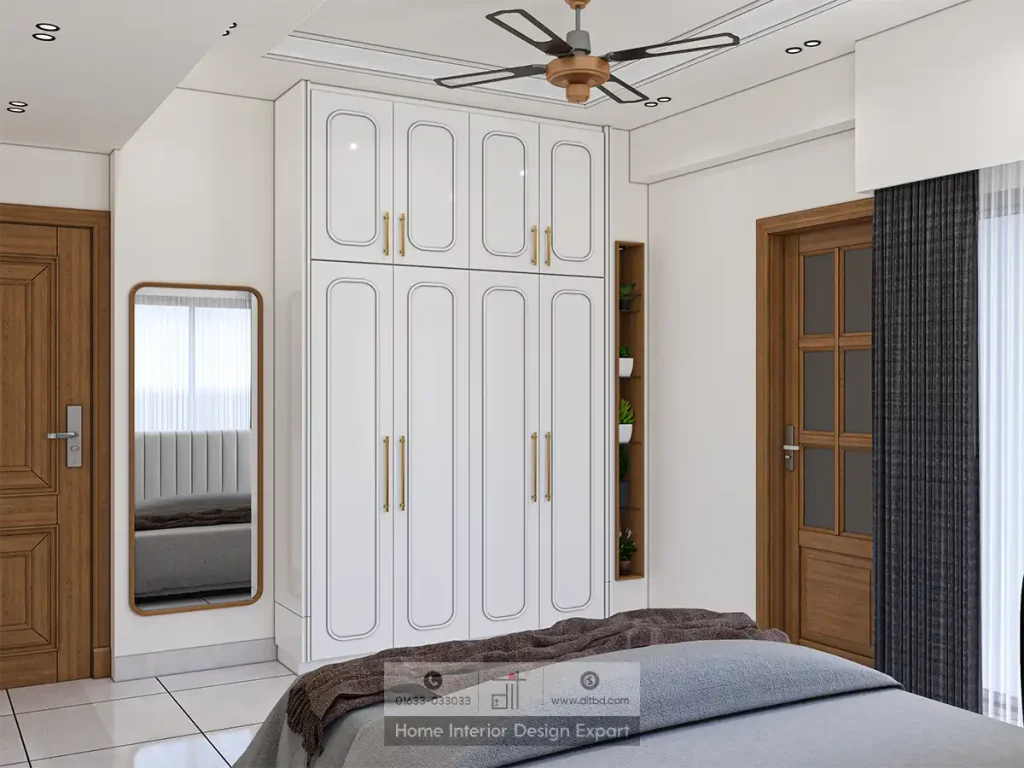 White paneled wardrobe with gold handles and full-length mirror in Aftabnagar bedroom by DIT Studio