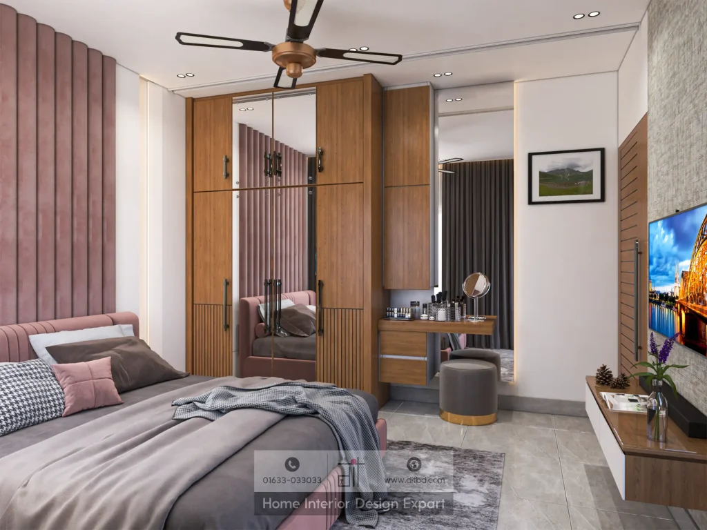 Walnut wardrobe with full-length mirror panel and pink tufted headboard in Dhanmondi by DIT Studio