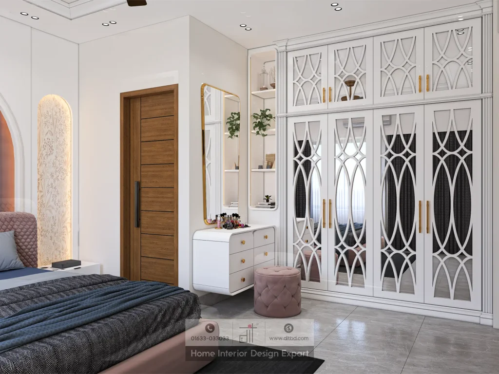 White fretwork wardrobe with mirrored panels and pink velvet vanity stool in girls bedroom in Banshundhara R/A by DIT Studio