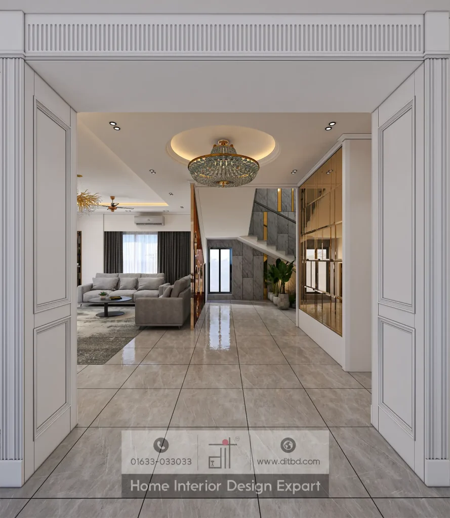 Foyer entrance with circular crystal chandelier, marble staircase, and gold mirror wall in Keraniganj duplex by DIT Studio