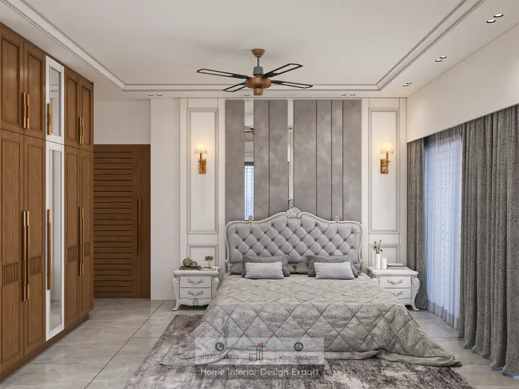 Alternate view of master bedroom showing walnut wardrobe with gold handles, grey curtains, and silver quilted bedspread by DIT Studio