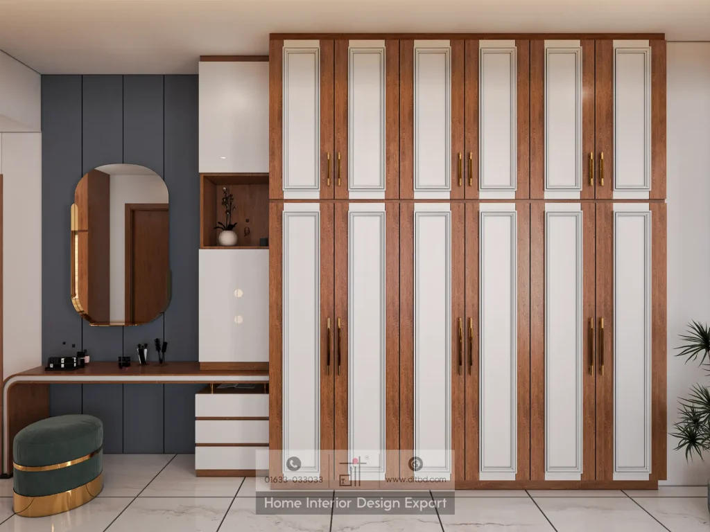 Walnut and white panelled wardrobe with gold handles, charcoal vanity wall, pill-shaped mirror, and green velvet ottoman in Mohammadpur bedroom