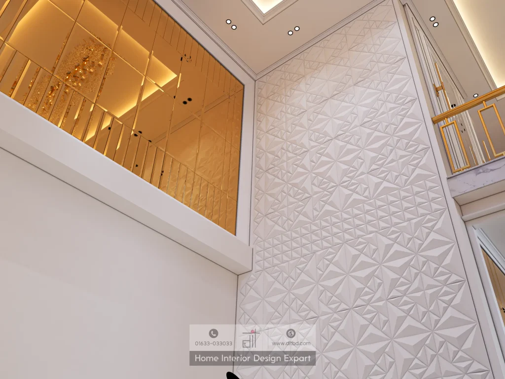 Double-height 3D textured wall and gold mirror panel in stairwell of Keraniganj home by DIT Studio