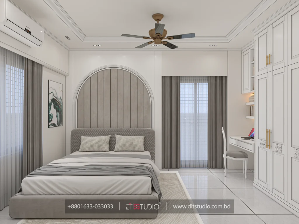 Girls bedroom with arched grey upholstered headboard, ceiling fan and white study desk