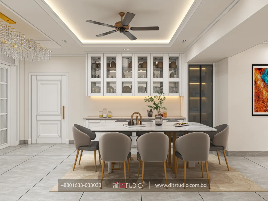Six seater marble dining table below glass front cabinets with warm accent lighting
