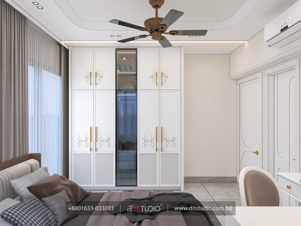 Girls bedroom wardrobe wall in white with gold handles and a mirrored centre section