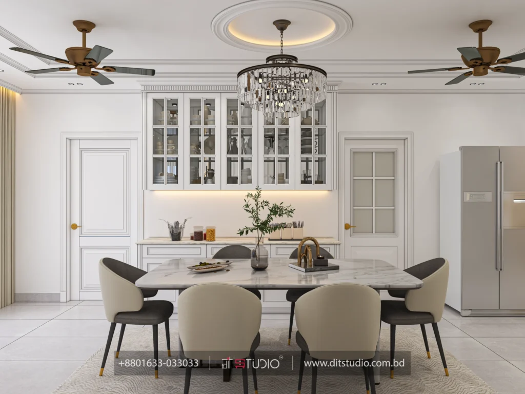 Dining table framed by lit glass front cabinets, marble counter and a side by side refrigerator